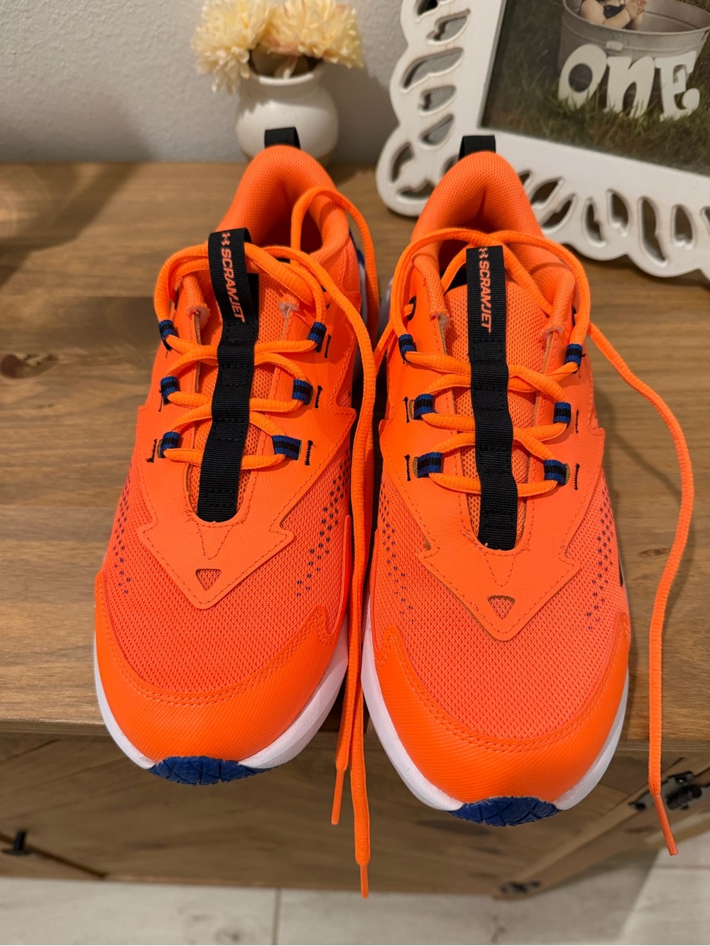 Under Armour Bright Orange Kids Sneakers with Black Accents